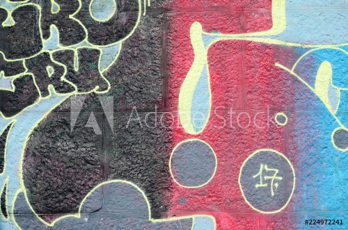 Image de Fragment of graffiti drawings The old wall decorated with paint stains in the style of street art culture Multicolored background texture